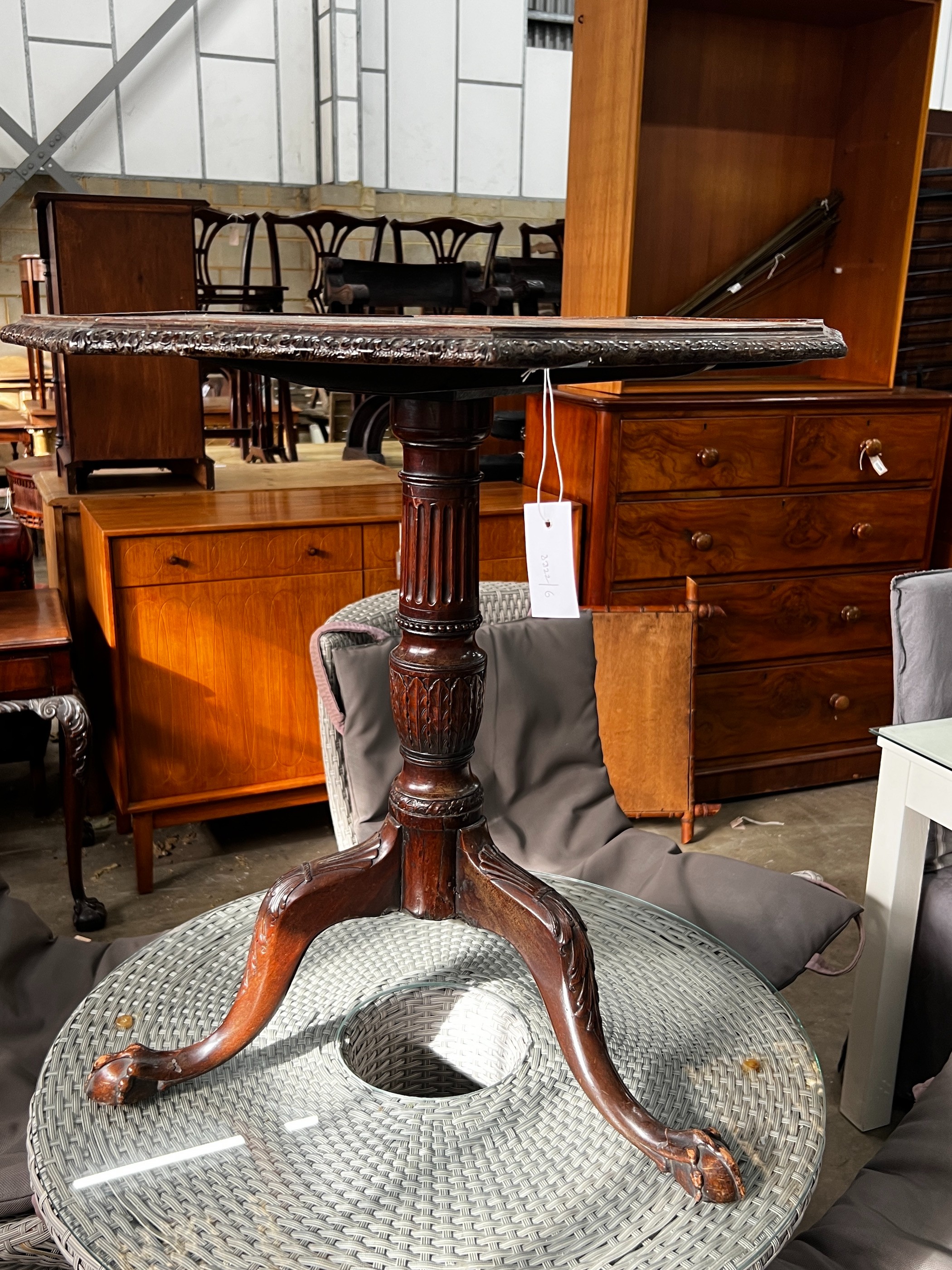 A George III and later octagonal mahogany tilt top tripod tea table, width 68cm, height 74cm